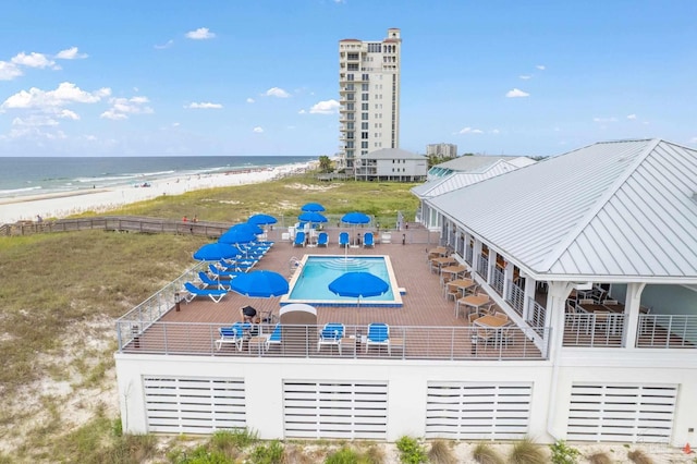 aerial view featuring a view of the beach and a water view