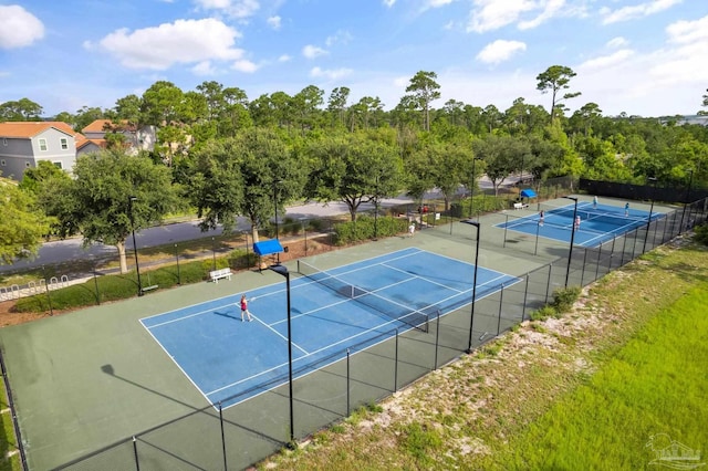 view of tennis court with fence