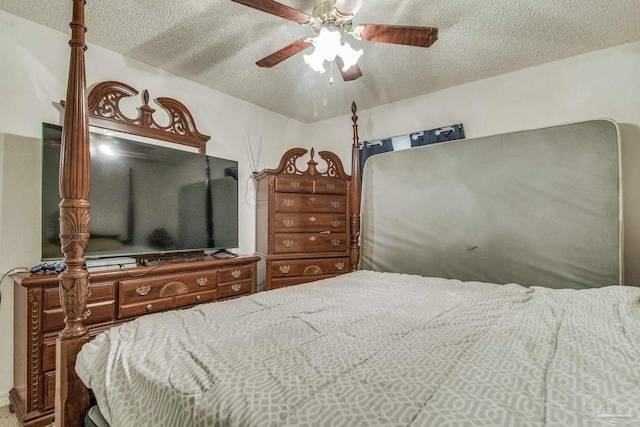 bedroom featuring a textured ceiling and ceiling fan