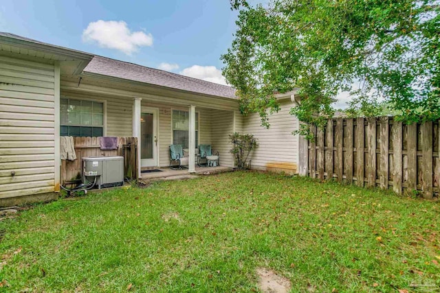 rear view of house with a lawn