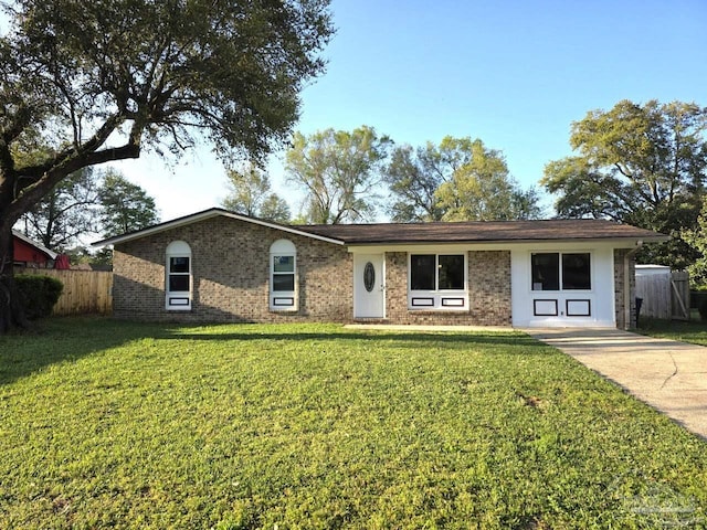 1836 Nestle Dr, Pensacola, FL 32534 - ranch-style house with brick siding, fence, and a front lawn