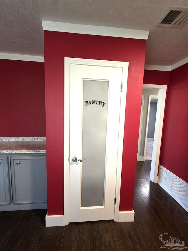 1836 Nestle Dr, Pensacola, FL 32534 - hall with dark wood-style floors, baseboards, and visible vents