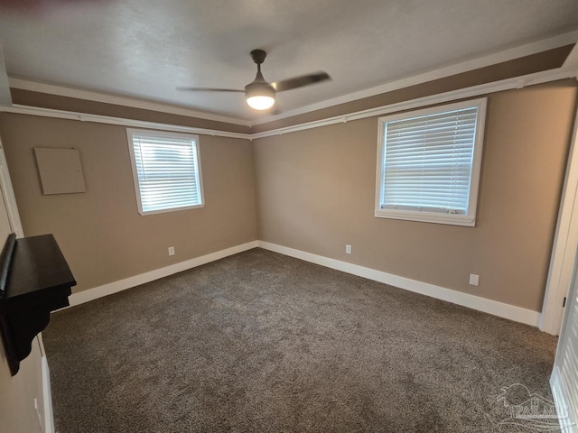 1836 Nestle Dr, Pensacola, FL 32534 - unfurnished bedroom featuring baseboards, ceiling fan, and dark colored carpet