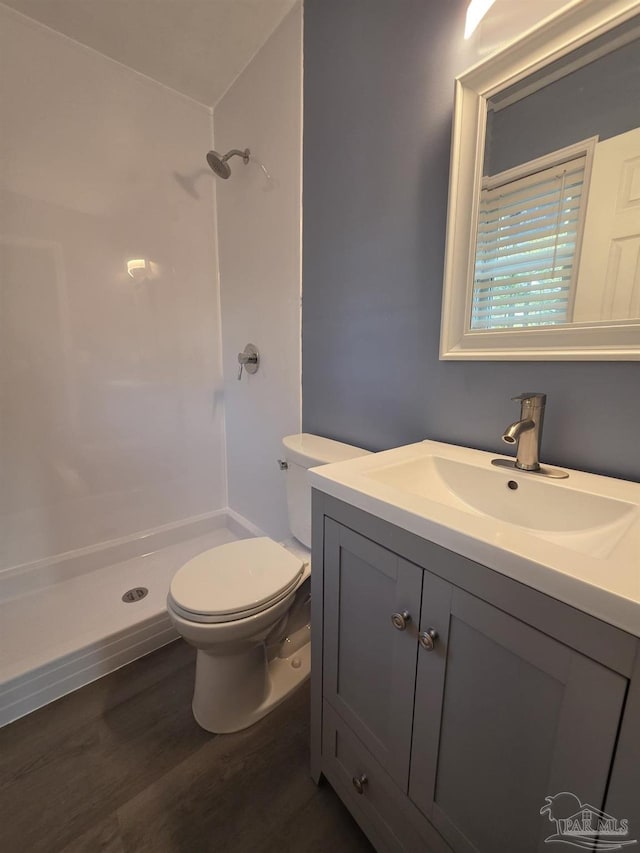 1836 Nestle Dr, Pensacola, FL 32534 - full bathroom featuring a shower stall, wood finished floors, toilet, and vanity