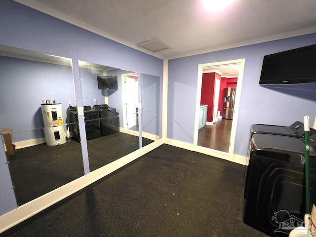 1836 Nestle Dr, Pensacola, FL 32534 - below grade area with baseboards, electric water heater, washing machine and clothes dryer, and stainless steel refrigerator with ice dispenser