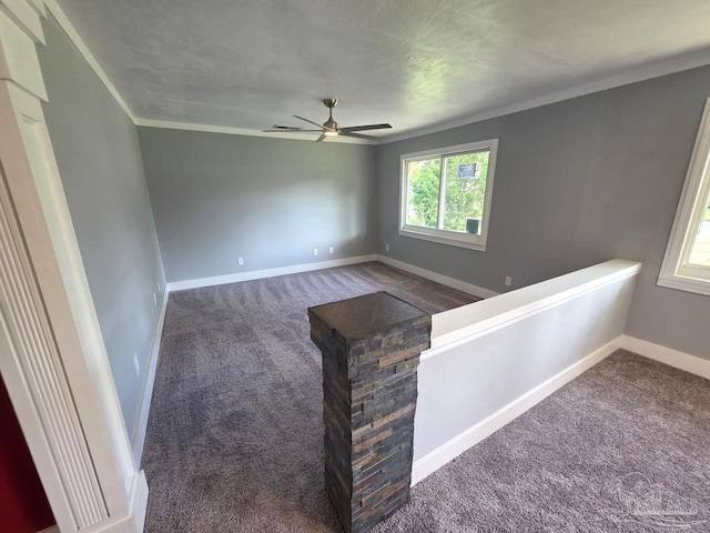 1836 Nestle Dr, Pensacola, FL 32534 - spare room featuring carpet flooring, a ceiling fan, crown molding, and baseboards