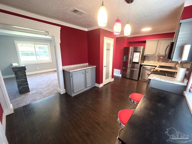 1836 Nestle Dr, Pensacola, FL 32534 - kitchen featuring gray cabinetry, visible vents, appliances with stainless steel finishes, and dark wood-type flooring