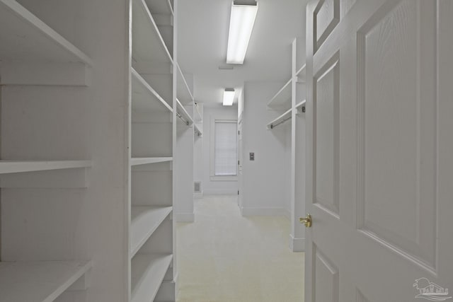 walk in closet with visible vents