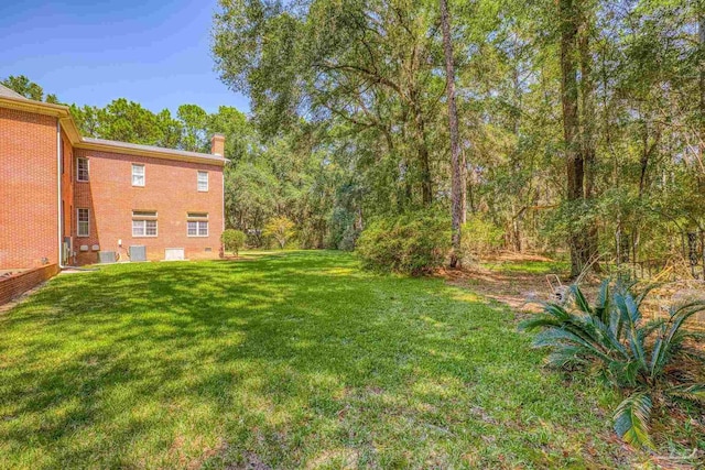 view of yard featuring central AC