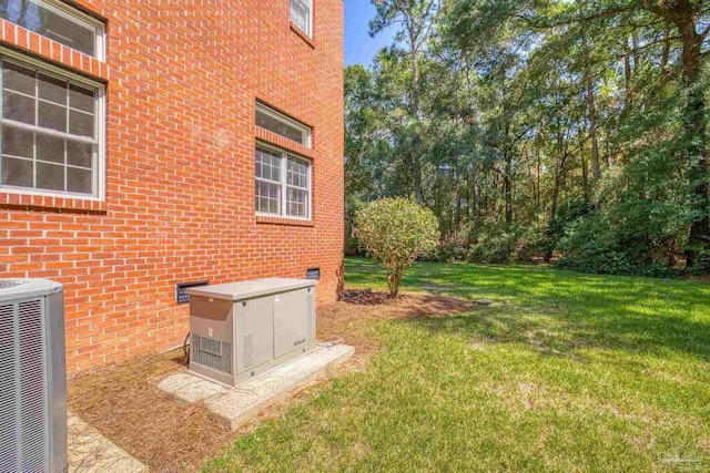 view of yard with central AC