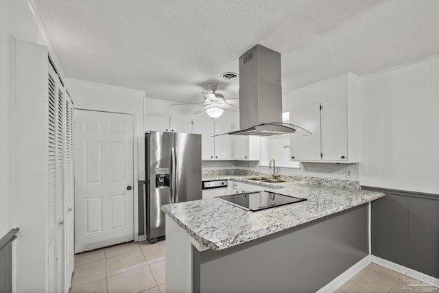 kitchen featuring ceiling fan, a peninsula, stainless steel refrigerator with ice dispenser, island exhaust hood, and a sink