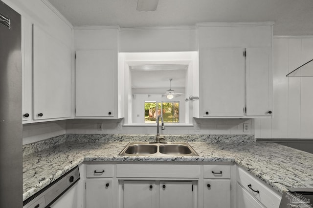 kitchen with dishwasher, a sink, a ceiling fan, and white cabinets