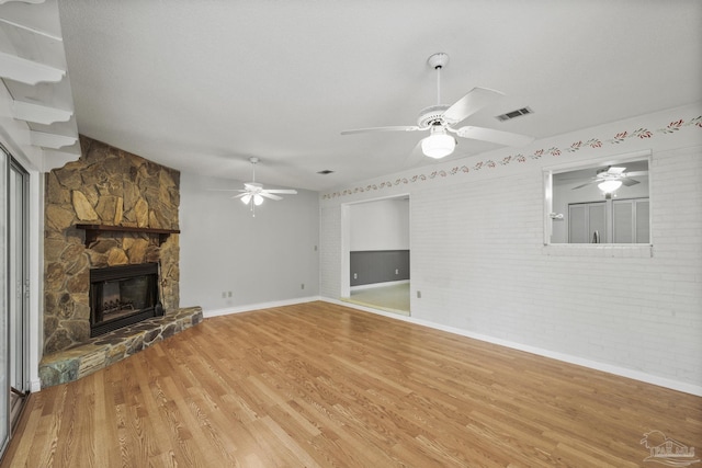 unfurnished living room featuring light wood-style flooring, visible vents, ceiling fan, and baseboards