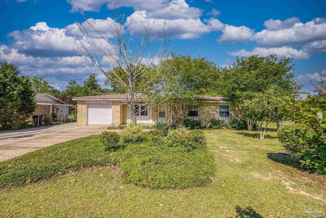 view of front facade featuring a front lawn, a garage, and driveway