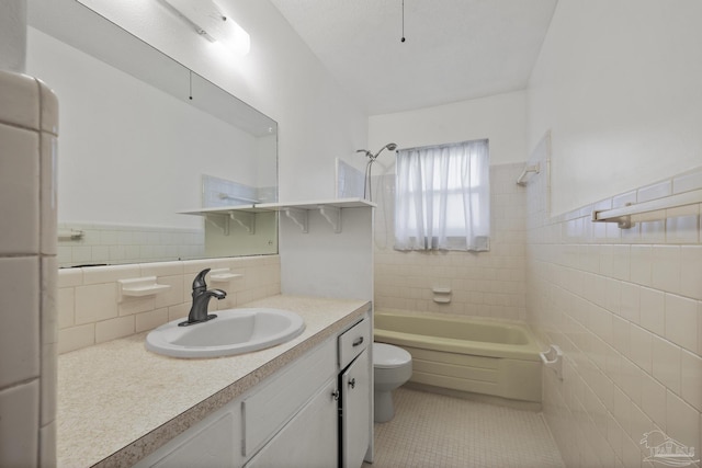 bathroom featuring vanity, tile patterned floors, toilet, bathtub / shower combination, and tile walls