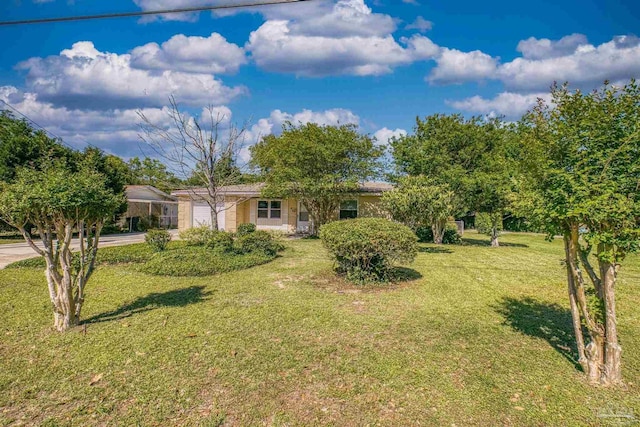 single story home with an attached garage, concrete driveway, and a front lawn