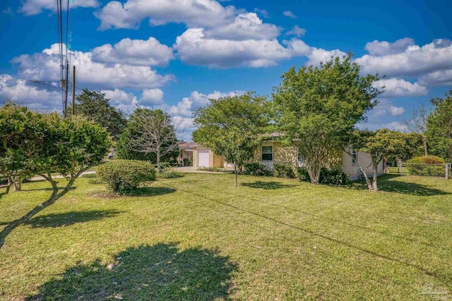 view of yard with a garage