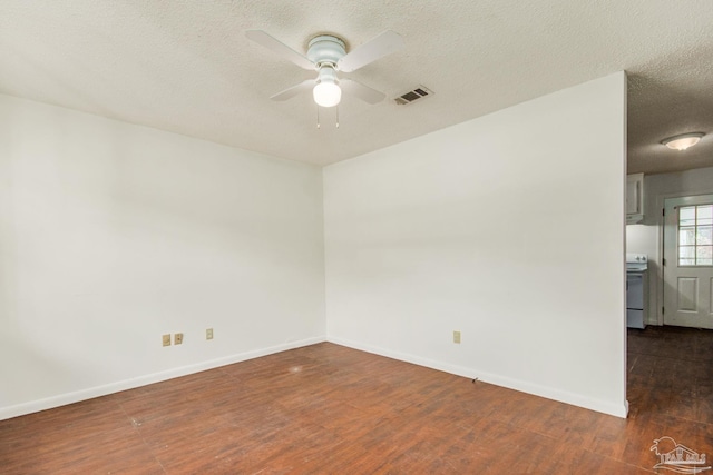 unfurnished room featuring a textured ceiling, dark hardwood / wood-style flooring, and ceiling fan