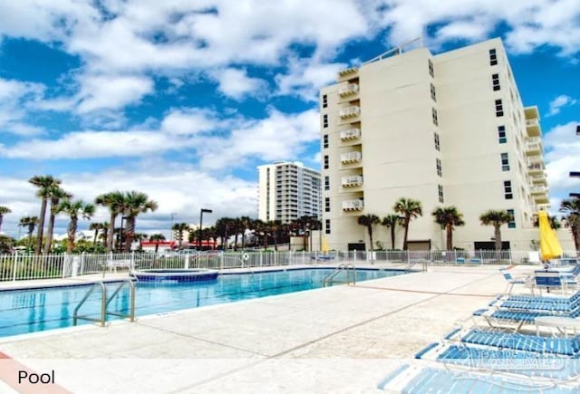 999 Ft Pickens Rd Unit 108, Pensacola Beach, FL 32561 - community pool featuring fence and a patio