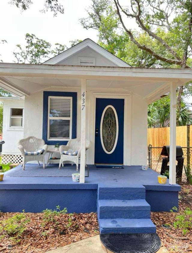 property entrance featuring covered porch