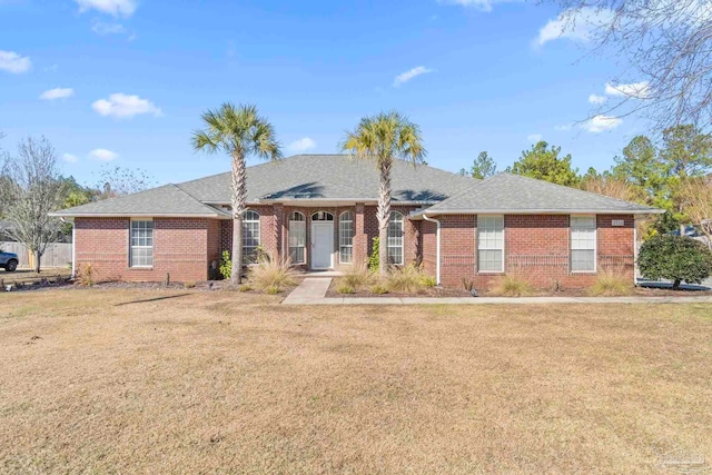 ranch-style house featuring a front yard