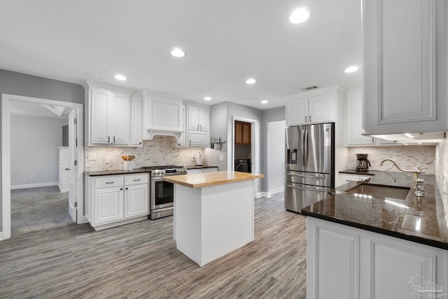 kitchen featuring white cabinetry, sink, and appliances with stainless steel finishes