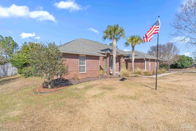 ranch-style house with a front lawn