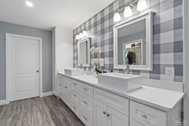 bathroom featuring hardwood / wood-style flooring and vanity