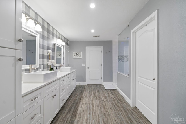 bathroom featuring vanity and wood-type flooring