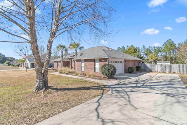 view of front of house featuring a garage and a front lawn