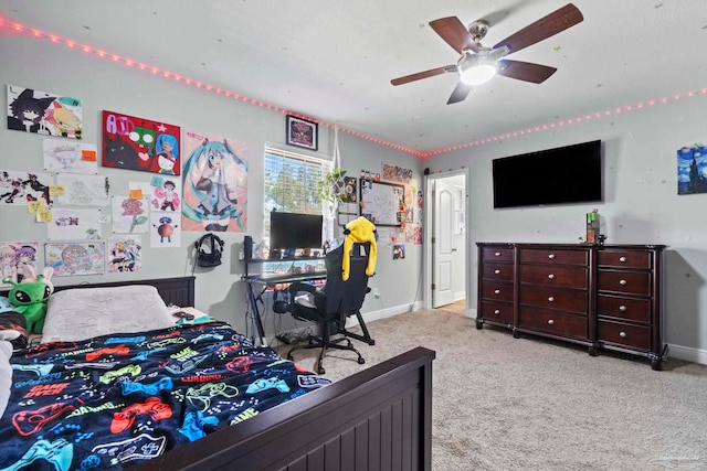 bedroom featuring light colored carpet and ceiling fan