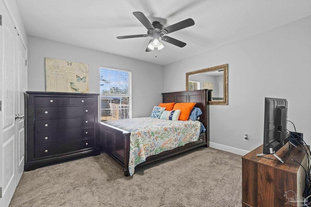 bedroom featuring ceiling fan and light colored carpet