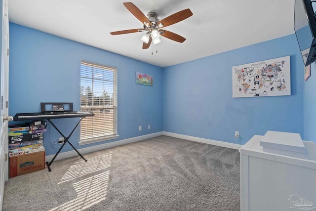 misc room with ceiling fan and carpet