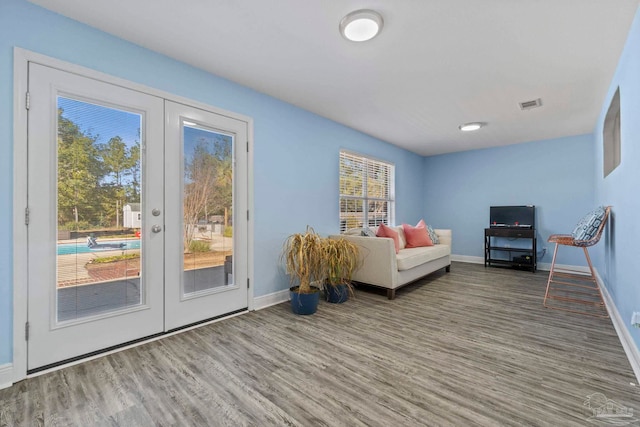 unfurnished room featuring hardwood / wood-style floors and french doors