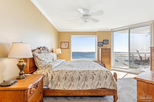 carpeted bedroom with access to exterior, ceiling fan, and ornamental molding