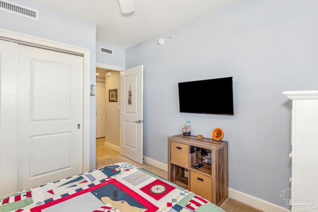 bedroom with ceiling fan and a closet