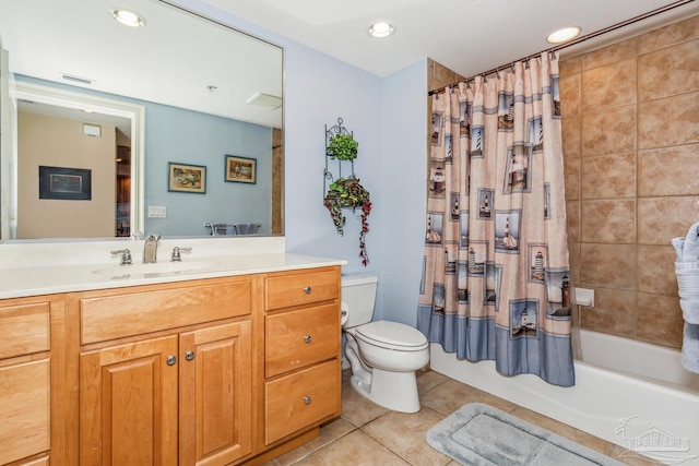 full bathroom featuring tile patterned floors, shower / tub combo with curtain, vanity, and toilet