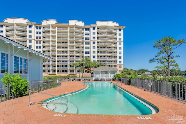 view of swimming pool with a patio