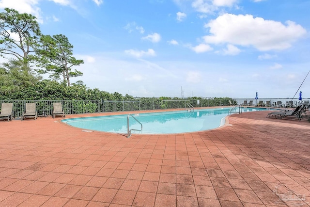 view of pool featuring a patio