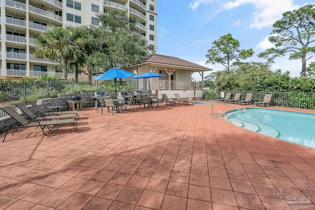 view of swimming pool featuring a patio