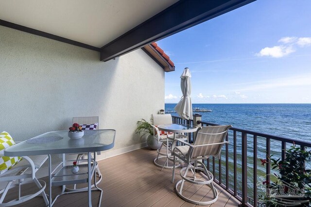 balcony featuring a water view