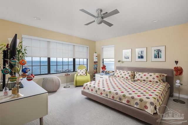 bedroom with light carpet and ceiling fan