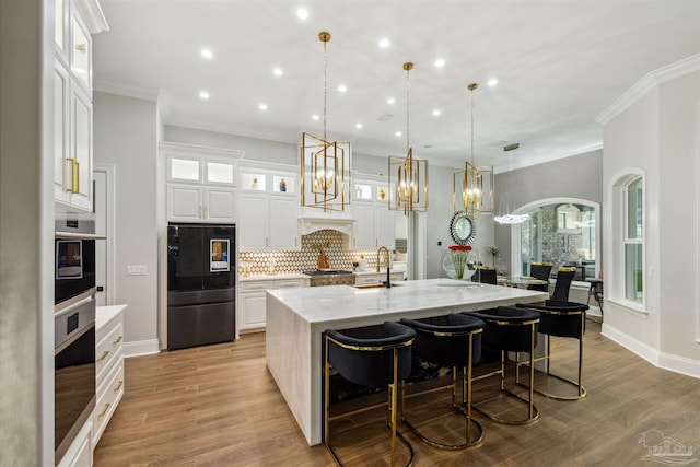 6126 E Fence Rd, Pensacola, FL 32526 - kitchen with wall oven, backsplash, recessed lighting, a large island, and white cabinetry