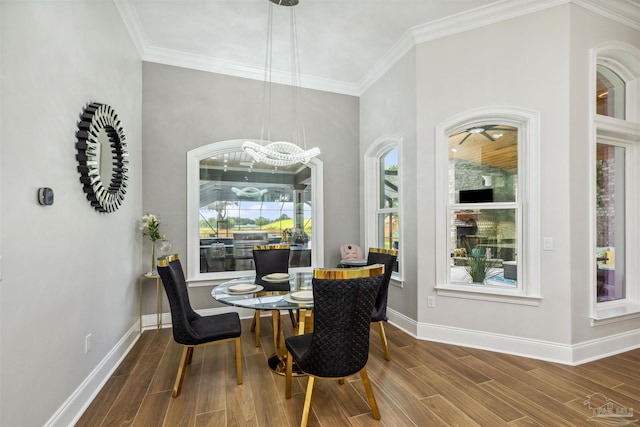 6126 E Fence Rd, Pensacola, FL 32526 - dining room with a chandelier, wood finished floors, and crown molding