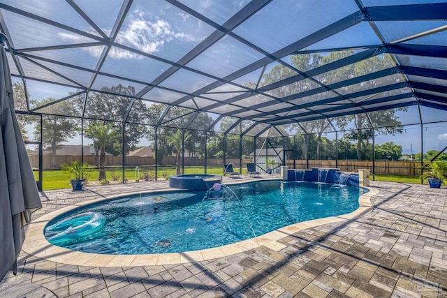 6126 E Fence Rd, Pensacola, FL 32526 - view of pool featuring a pool with connected hot tub, a patio area, a fenced backyard, and a storage unit
