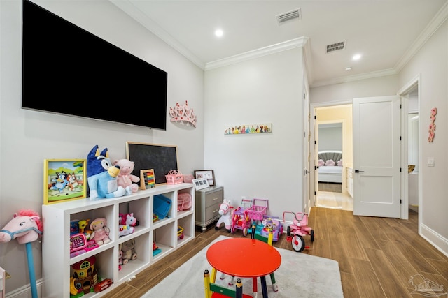 6126 E Fence Rd, Pensacola, FL 32526 - playroom featuring wood finished floors, ornamental molding, and recessed lighting