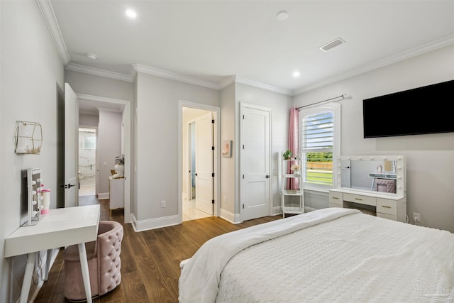 6126 E Fence Rd, Pensacola, FL 32526 - bedroom with wood finished floors, ornamental molding, recessed lighting, and ensuite bath