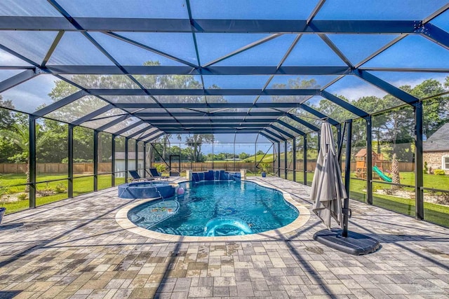 6126 E Fence Rd, Pensacola, FL 32526 - view of swimming pool with a playground, a pool with connected hot tub, a patio, a fenced backyard, and a lanai