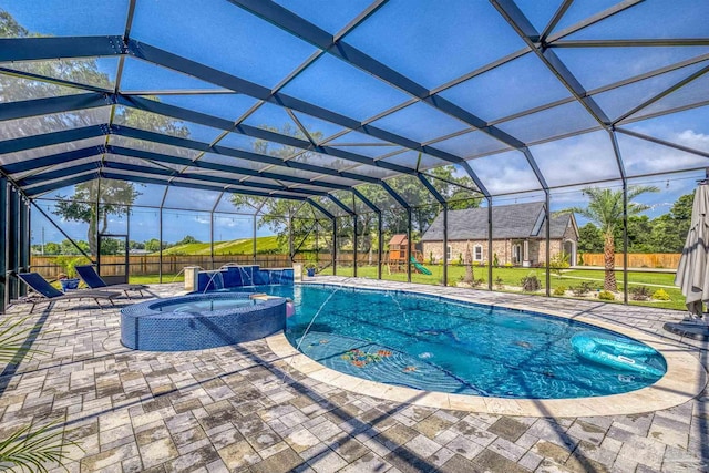 6126 E Fence Rd, Pensacola, FL 32526 - view of pool featuring a playground, a pool with connected hot tub, a patio area, and a fenced backyard