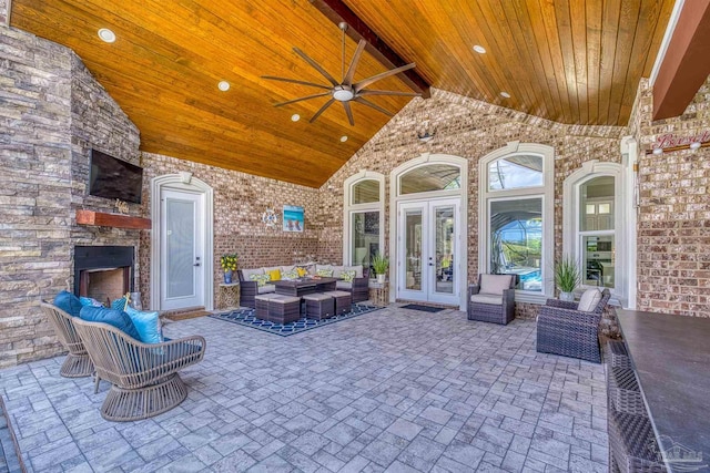 6126 E Fence Rd, Pensacola, FL 32526 - view of patio / terrace featuring french doors, an outdoor living space with a fireplace, and a ceiling fan